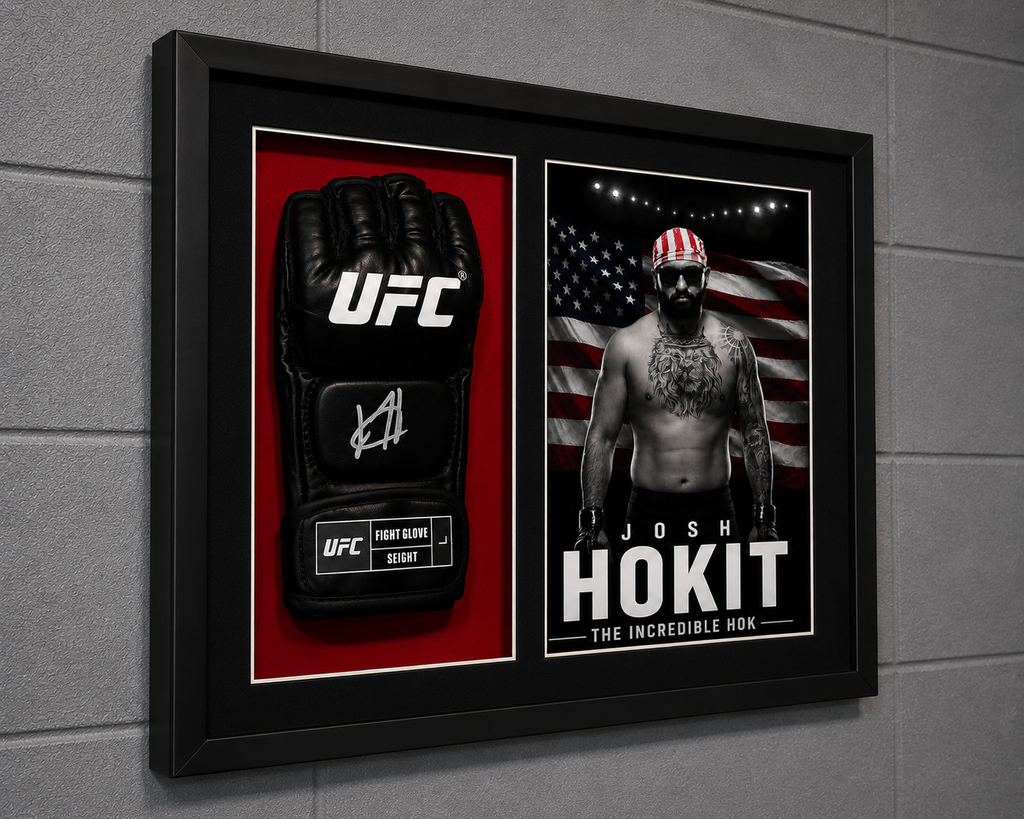 A framed UFC memorabilia display mounted on a gray wall, featuring a black UFC glove on a red background and a black-and-white portrait of Josh Hokit with an American flag backdrop inside a black frame.
