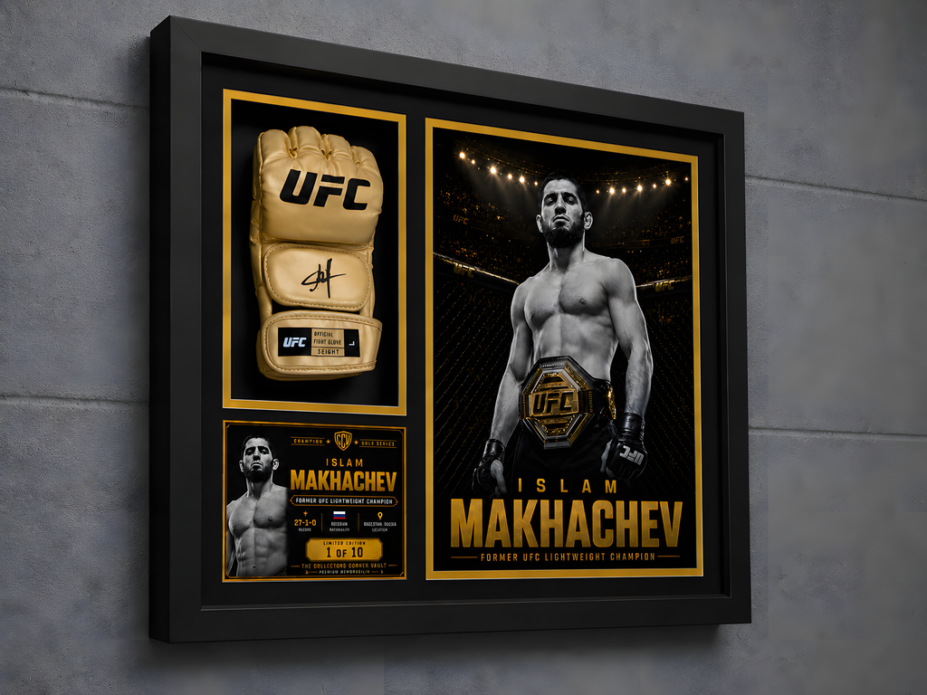 A framed UFC memorabilia display mounted on a gray wall. The black shadowbox frame contains a beige UFC glove on the left, a black-and-gold poster of Islam Makhachev on the right, and a small match-card style insert at the bottom left.