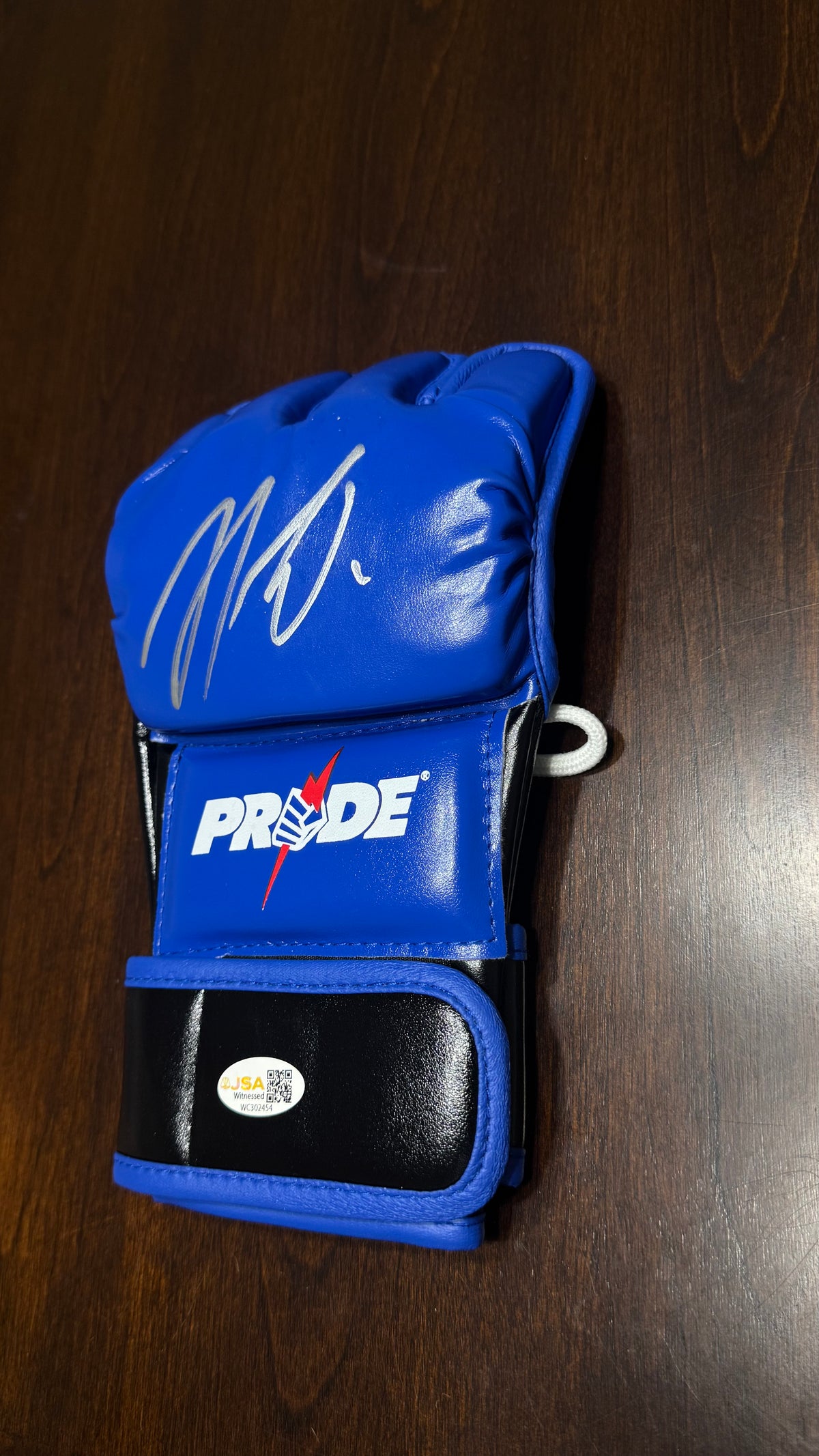 : Back of Nick Diaz signed PRIDE glove showing JSA Witnessed certification WC302454
