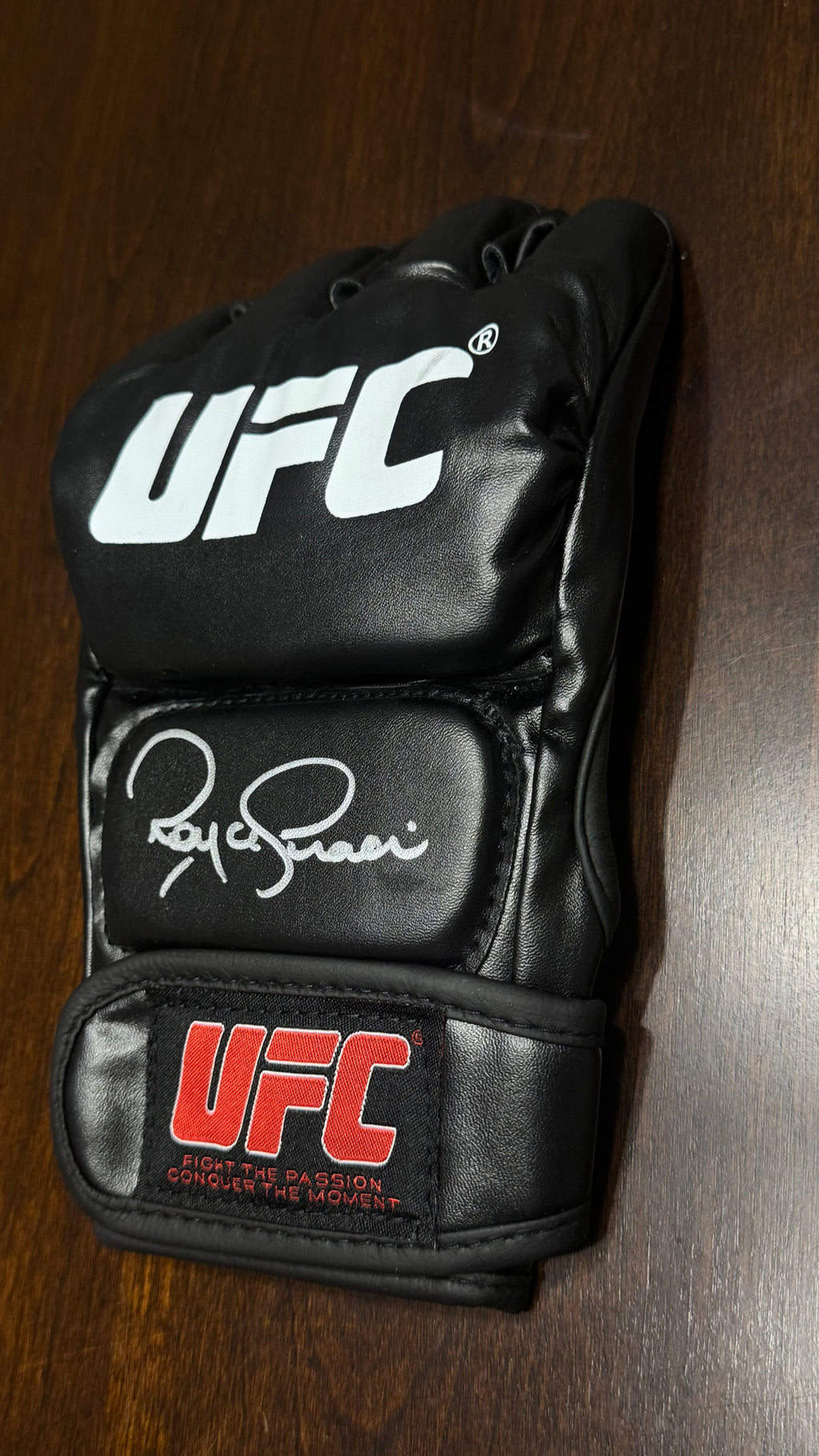 Royce Gracie signed black UFC MMA glove with silver autograph, Beckett witnessed