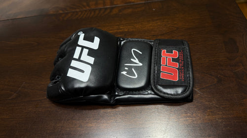CAIN VELASQUEZ SIGNED UFC GLOVE — BECKETT AUTHENTICATED