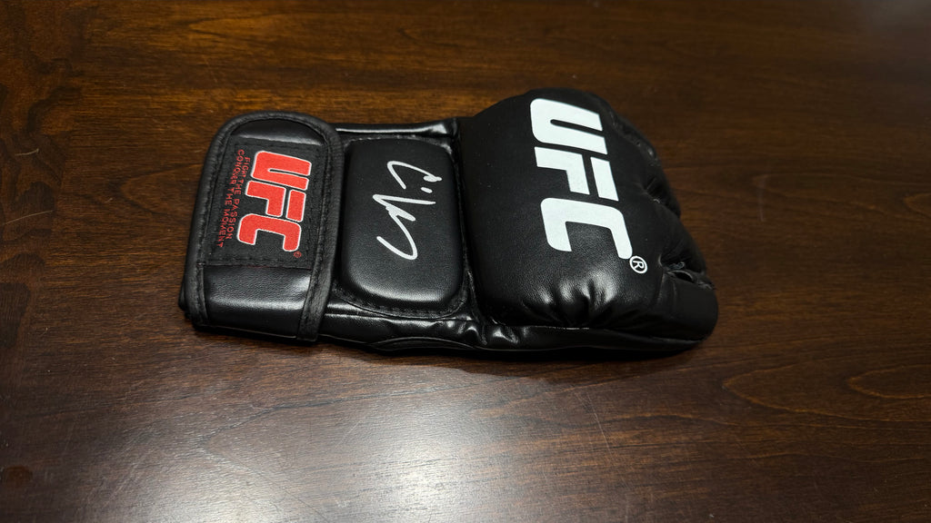 CAIN VELASQUEZ SIGNED UFC GLOVE — BECKETT AUTHENTICATED