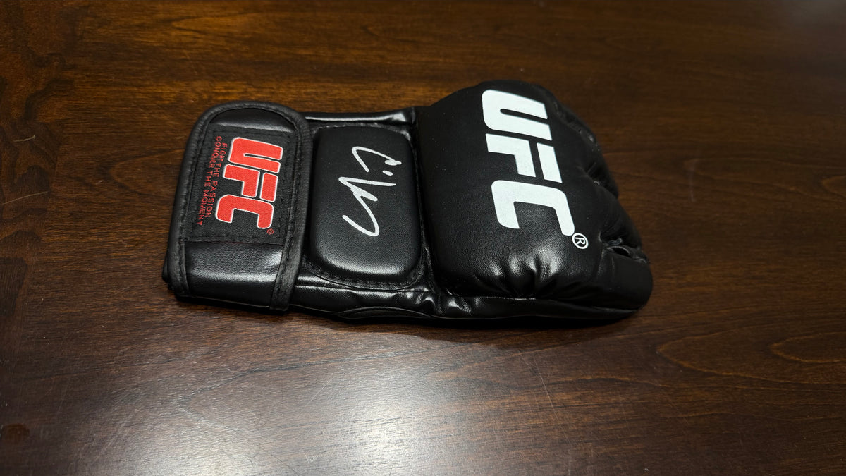 CAIN VELASQUEZ SIGNED UFC GLOVE — BECKETT AUTHENTICATED