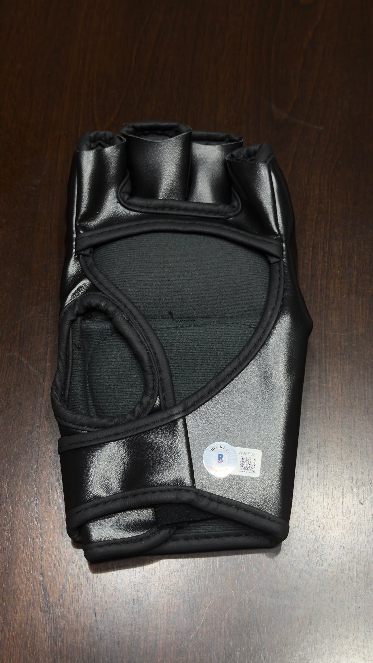 Back of Francis Ngannou autographed UFC glove