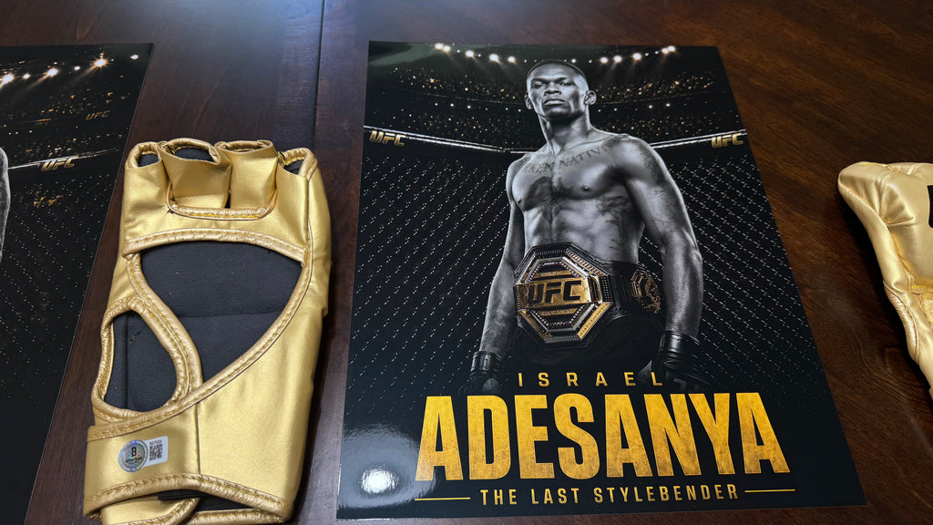 Israel Adesanya hand-signed gold UFC glove authenticated by Beckett Authentication Services under certification BS75324.