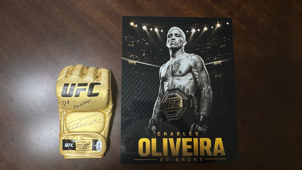 JSA authentication sticker CR27855 on the Charles Oliveira signed gold UFC glove.
