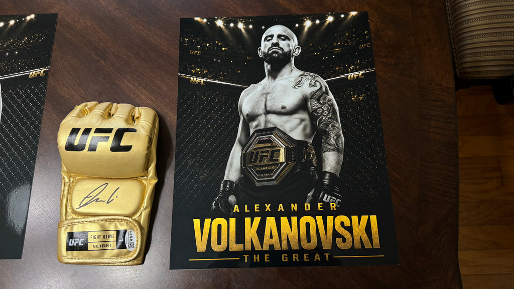 JSA authentication sticker CS60196 attached to the Alexander Volkanovski signed gold UFC glove.