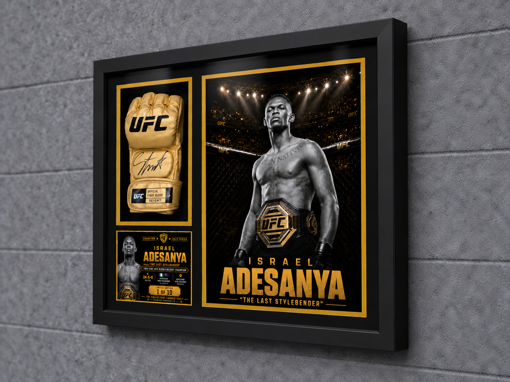 Right-angle view showing the depth, gold-accent matting and museum-style construction of the Israel Adesanya signed UFC glove display